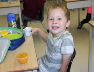 Community Christian School Student Eating Lunch